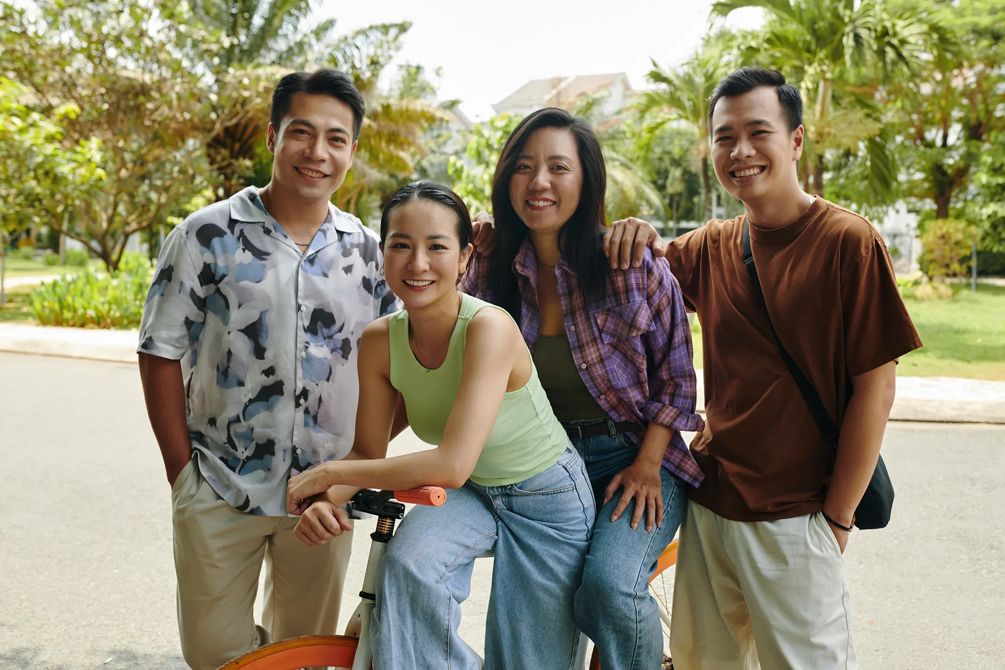 Two male and two female Filipinos posing as a group for the camera